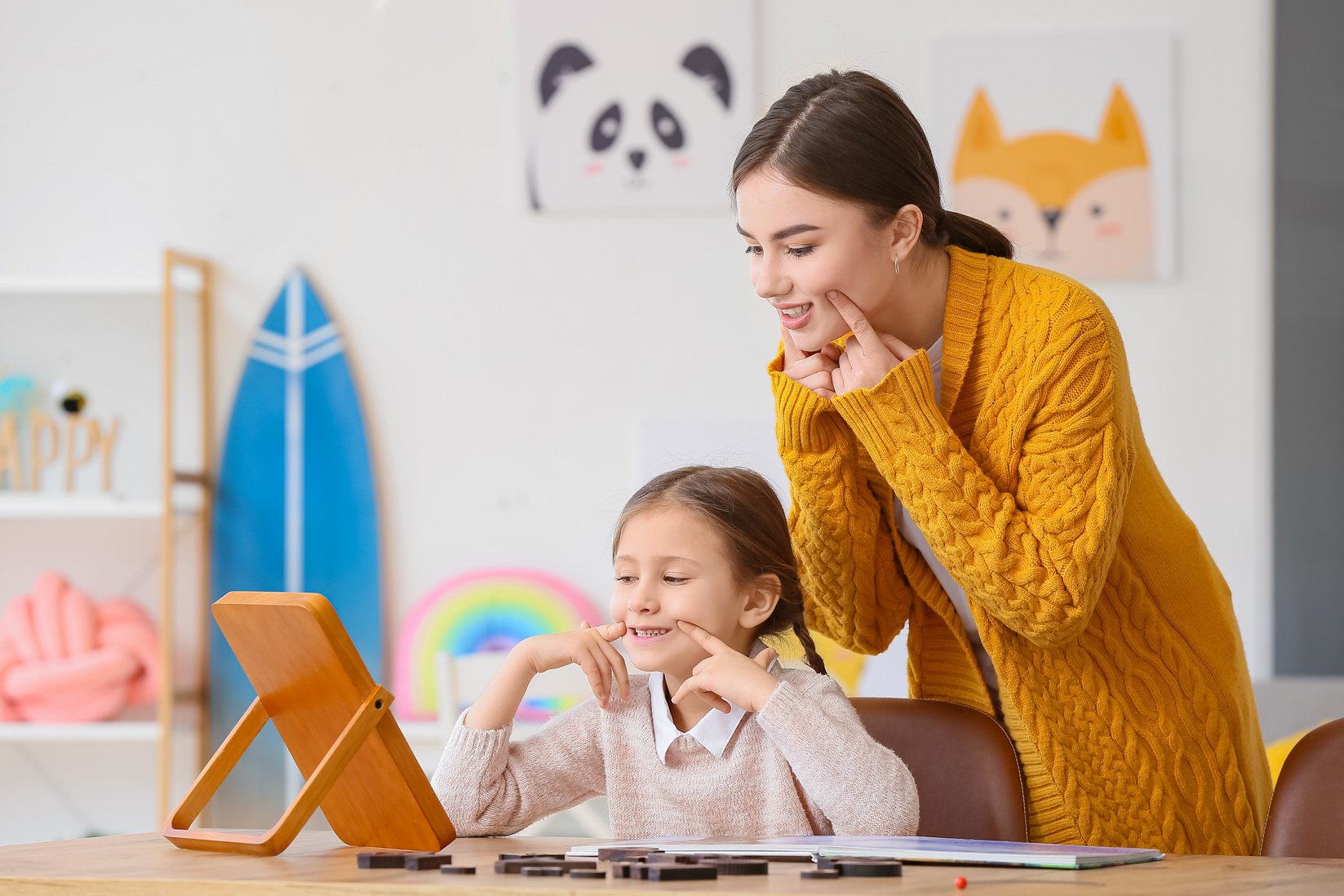 Speech Therapist Working with Cute Girl in Clinic